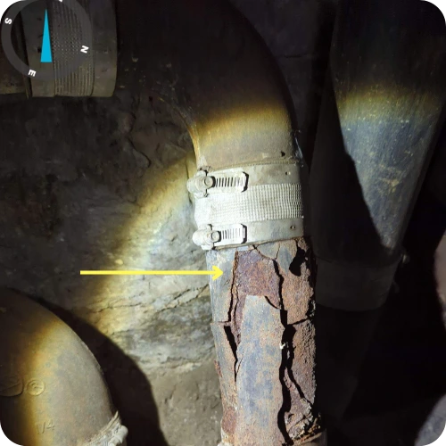 Close-up image showing drain line deterioration