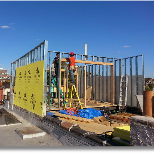Early-stage construction work for a rooftop renovation
