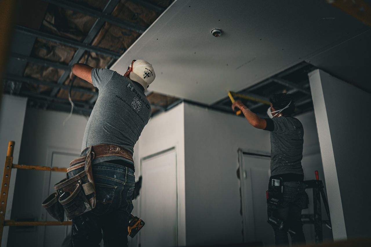 HPRE+D crew installing ceiling finishes during an interior renovation